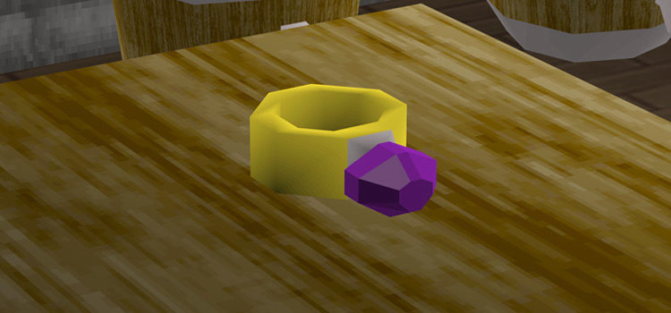 Charged Ring of Wealth on a table (OSRS)