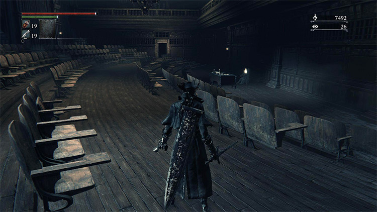 The empty lecture hall and the dead lecturer which holds the Lecture Theatre Key / Bloodborne