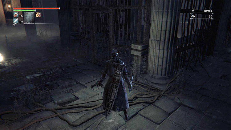 The metal gate that leads to the exit of the ruined building / Bloodborne