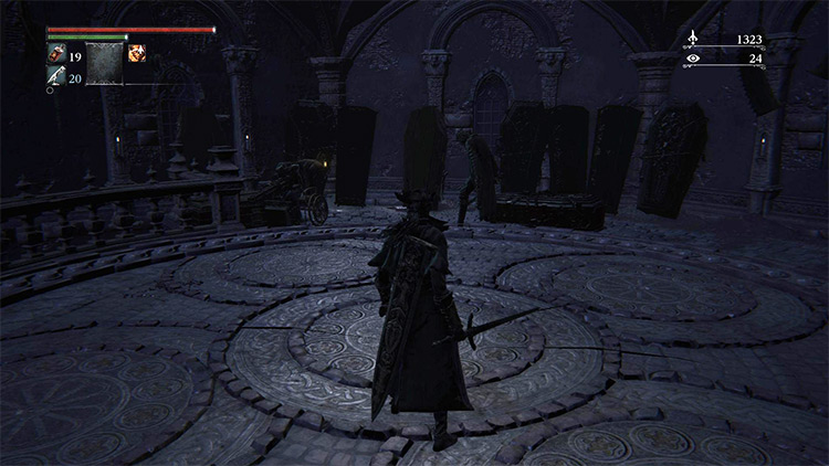 The coffins next to the staircase railing - the Rifleman is hidden in the darkness to the left / Bloodborne