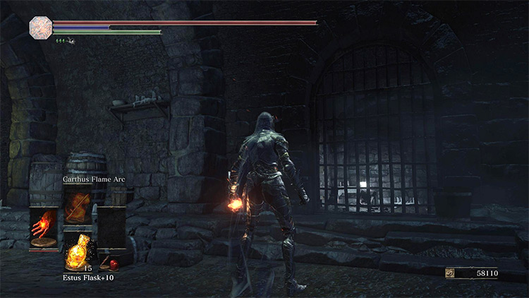 A corpse holding a Rusted Gold Coin in the unlockable cell / DS3
