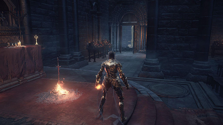 The Cleansing Chapel Bonfire with the first shortcut door in the background / Dark Souls 3