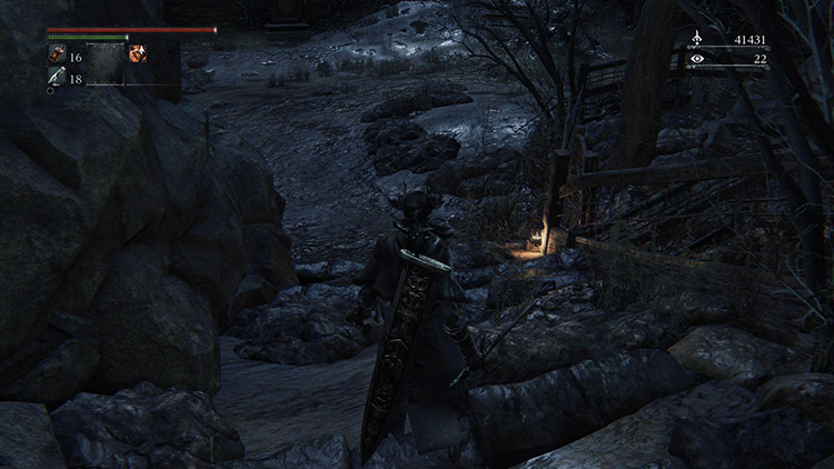 Walking past the lantern at the bottom of the steps triggers the start of the boss fight / Bloodborne