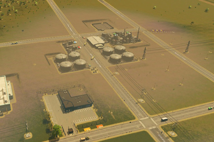 These oil industry buildings turn the surrounding land this ashy brown, indicating ground pollution. / Cities: Skylines