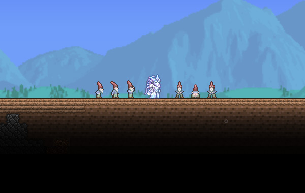 The player standing between Garden Gnomes / Terraria