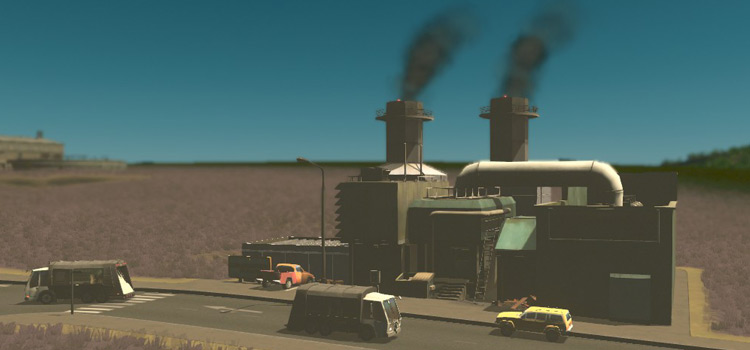 An incineration plant with some garbage trucks driving past