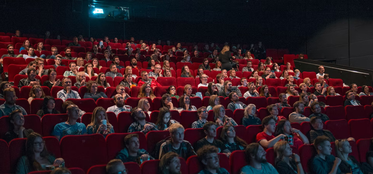 Theater of people watching a movie